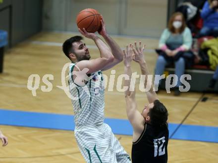 Basketball 2. Liga 2021/2022. Grunddurchgang 15. Runde.  KOS Celovec gegen  Woerthersee Piraten.  Marin Sliskovic (KOS),  Jan-Arne Apschner (Piraten). Klagenfurt, am 25.2.2022.
Foto: Kuess
www.qspictures.net
---
pressefotos, pressefotografie, kuess, qs, qspictures, sport, bild, bilder, bilddatenbank