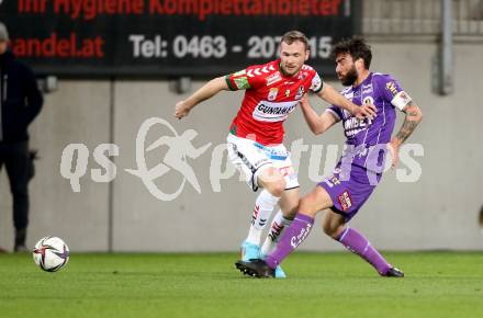 Fussball Bundesliga. SK Austria Klagenfurt gegen SV Guntamatic Ried.  Kosmas Gkezos, (Klagenfurt), Leo Mikic   (Ried). Klagenfurt, am 27.2.2022.
Foto: Kuess
www.qspictures.net
---
pressefotos, pressefotografie, kuess, qs, qspictures, sport, bild, bilder, bilddatenbank