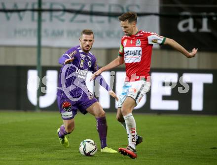 Fussball Bundesliga. SK Austria Klagenfurt gegen SV Guntamatic Ried.  Turgay Gemicibasi,  (Klagenfurt), Markus Lackner  (Ried). Klagenfurt, am 27.2.2022.
Foto: Kuess
www.qspictures.net
---
pressefotos, pressefotografie, kuess, qs, qspictures, sport, bild, bilder, bilddatenbank