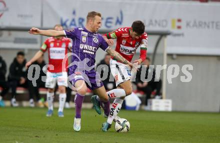 Fussball Bundesliga. SK Austria Klagenfurt gegen SV Guntamatic Ried.  Florian Jaritz,  (Klagenfurt),  Ante Bajic (Ried). Klagenfurt, am 27.2.2022.
Foto: Kuess
www.qspictures.net
---
pressefotos, pressefotografie, kuess, qs, qspictures, sport, bild, bilder, bilddatenbank