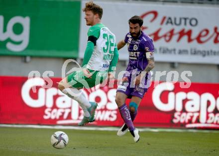 Fussball Bundesliga. Play-off. SK Austria Klagenfurt gegen Rapid Wien.  Kosmas Gkezos, (Klagenfurt),  Ferdy Druijf   (Rapid). Klagenfurt, am 13.3.2022.
Foto: Kuess
www.qspictures.net
---
pressefotos, pressefotografie, kuess, qs, qspictures, sport, bild, bilder, bilddatenbank