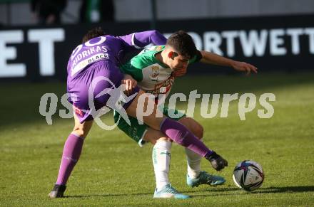 Fussball Bundesliga. Play-off. SK Austria Klagenfurt gegen Rapid Wien.  Lukas Fridrikas,  (Klagenfurt), Yusuf Demir  (Rapid). Klagenfurt, am 13.3.2022.
Foto: Kuess
www.qspictures.net
---
pressefotos, pressefotografie, kuess, qs, qspictures, sport, bild, bilder, bilddatenbank