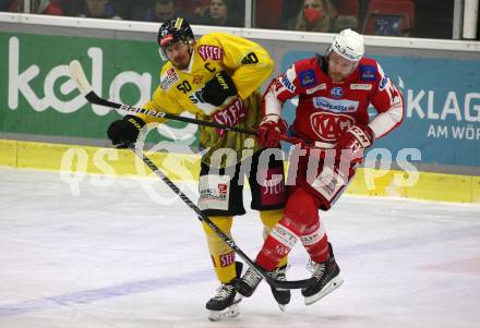 EBEL. Eishockey Bundesliga. KAC gegen	spusu Vienna Capitals. Paul Postma,  (KAC),  Mario Fischer (Vienna Capitals). Klagenfurt, am 13.3.2022.
Foto: Kuess
www.qspictures.net

---
pressefotos, pressefotografie, kuess, qs, qspictures, sport, bild, bilder, bilddatenbank