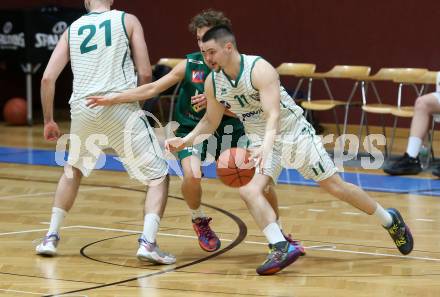 Basketball 2. Liga 2021/2022. Grunddurchgang 13. Runde.  KOS Celovec gegen  Dornbirn Lions.  Grega Sajevic (KOS), Luis Erath   (Dornbirn). Klagenfurt, am 19.3.2022.
Foto: Kuess
www.qspictures.net
---
pressefotos, pressefotografie, kuess, qs, qspictures, sport, bild, bilder, bilddatenbank