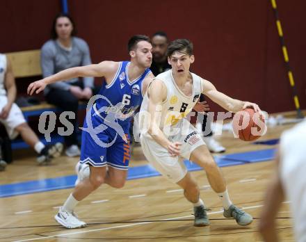 Basketball Zweite Liga 2021/2022. Grunddurchgang 16. Runde.  Woerthersee Piraten gegen Kufstein Towers.  Felix Leindecker (Piraten),  Luka Bozak (Kufstein). Klagenfurt, am 20.3.2022. 
Foto: Kuess
www.qspictures.net

---
pressefotos, pressefotografie, kuess, qs, qspictures, sport, bild, bilder, bilddatenbank