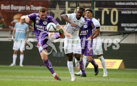 Fussball Bundesliga. Play-off. SK Austria Klagenfurt gegen SK Sturm Graz.  Turgay Gemicibasi, (Klagenfurt), Niangbo Dogbole Franck Anderson   (Graz). Klagenfurt, am 8.5.2022.
Foto: Kuess
www.qspictures.net
---
pressefotos, pressefotografie, kuess, qs, qspictures, sport, bild, bilder, bilddatenbank