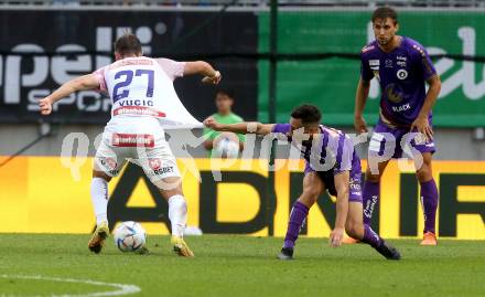 Fussball Bundesliga.  SK Austria Klagenfurt gegen FK Austria Wien.   Till Sebastian Schumacher, (Klagenfurt),  Romeo Vucic   (Wien). Klagenfurt, am 28.8.2022. 
Foto: Kuess

---
pressefotos, pressefotografie, kuess, qs, qspictures, sport, bild, bilder, bilddatenbank