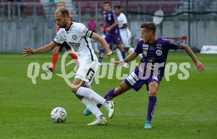 Fussball Bundesliga.  SK Austria Klagenfurt gegen SK Puntigamer Sturm Graz.   Florian Rieder, (Klagenfurt), Jon Gorenc Stankovic   (Graz). Klagenfurt, am 11.9..2022. 
Foto: Kuess

---
pressefotos, pressefotografie, kuess, qs, qspictures, sport, bild, bilder, bilddatenbank