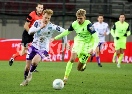 Fussball Woertherseecup. SK Austria Klagenfurt gegen 1860 Muenchen.  Jonas Arweiler, (Austria Klagenfurt),  Leandro Morgalla   (1860 Muenchen). Klagenfurt, 20.11.2022.
Foto: Kuess
---
pressefotos, pressefotografie, kuess, qs, qspictures, sport, bild, bilder, bilddatenbank