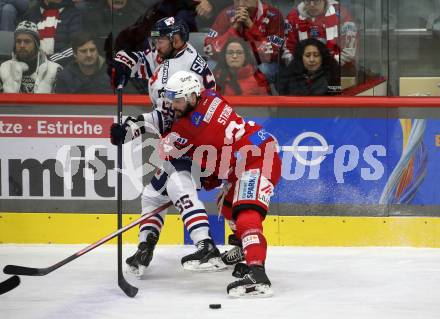 EBEL. Eishockey Bundesliga. EC KAC gegen  Hydro Fehervar AV 19.  Steven Strong,   (KAC),    Andrew Sarauer (Fehervar). Klagenfurt, am 17.1.2023.
Foto: Kuess
www.qspictures.net
---
pressefotos, pressefotografie, kuess, qs, qspictures, sport, bild, bilder, bilddatenbank