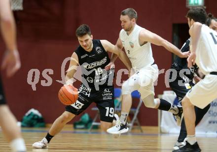 Basketball 2. Liga 2022/2023. Grunddurchgang 13. Runde.  KOS Celovec gegen  Guessing Blackbirds.   Tim Huber (KOS),   Jakob Ernst  (Guessing). Klagenfurt, am 21.1.2023.
Foto: Kuess
www.qspictures.net
---
pressefotos, pressefotografie, kuess, qs, qspictures, sport, bild, bilder, bilddatenbank