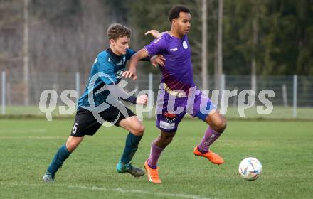 Fussball. Kaerntner Liga. Kraig gegen Austria Klagenfurt Amateure.   Paul Felsberger (Kraig),   Emilian Metu  (Klagenfurt). Treibach, 25.3.2023
Foto: Kuess


---
pressefotos, pressefotografie, kuess, qs, qspictures, sport, bild, bilder, bilddatenbank