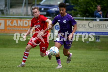 Fussball Kaerntner Liga. SK Austria KLagenfurt Amateure gegen ATSV Wolfsberg. Nico Armin El Hasnaoui  (Austria Klagenfurt),   Hubert Kothmaier (Wolfsberg). Brueckl, am 9.6.2023.
Foto: Kuess



---
pressefotos, pressefotografie, kuess, qs, qspictures, sport, bild, bilder, bilddatenbank