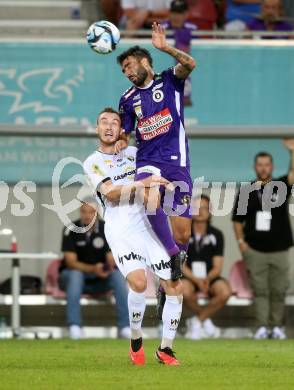 Fussball Bundesliga. SK Austria Klagenfurt gegen Cashpoint SCR Altach.   Kosmas Gkezos,  (Klagenfurt),  Mike Steven Baehre  (Altach).  Klagenfurt, am 19.8.2023.
Foto: Kuess
---
pressefotos, pressefotografie, kuess, qs, qspictures, sport, bild, bilder, bilddatenbank