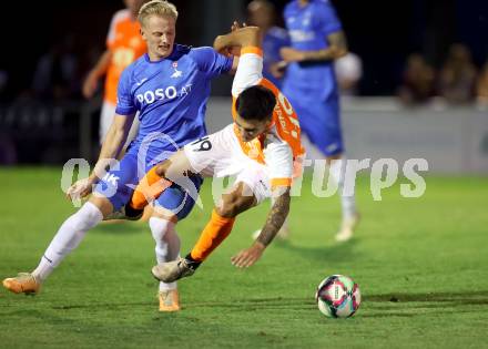 Fussball Kaerntner Liga. SAK gegen Donau.   Toni Dullnig  (SAK),   Damjan Jovanovic (Donau). Klagenfurt, am 15.9.2023.
Foto: Kuess
---
pressefotos, pressefotografie, kuess, qs, qspictures, sport, bild, bilder, bilddatenbank