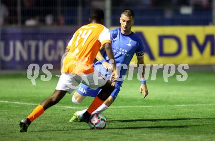 Fussball Kaerntner Liga. SAK gegen Donau.   Zoran Vukovic   (SAK),   Boyo Jarjue (Donau). Klagenfurt, am 15.9.2023.
Foto: Kuess
---
pressefotos, pressefotografie, kuess, qs, qspictures, sport, bild, bilder, bilddatenbank