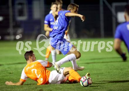 Fussball Kaerntner Liga. SAK gegen Donau.    Luka Gajic (SAK),  Thomas Christian Tatschl  (Donau). Klagenfurt, am 15.9.2023.
Foto: Kuess
---
pressefotos, pressefotografie, kuess, qs, qspictures, sport, bild, bilder, bilddatenbank