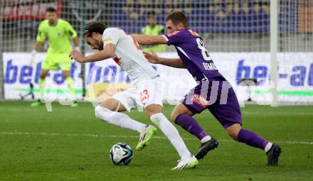 Fussball Bundesliga. SK Austria Klagenfurt gegen FC Red Bull Salzburg.  Turgay Gemicibasi,   (Klagenfurt),  Roko Simic  (Salzburg).  Klagenfurt, am 8.10.2023.
Foto: Kuess
---
pressefotos, pressefotografie, kuess, qs, qspictures, sport, bild, bilder, bilddatenbank