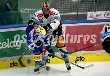 EBEL. Eishockey Bundesliga. EC VSV gegen Black Wings Linz.  Kevin Hancock, (VSV),  Martin Stajnoch   (Linz). Villach, am 27.10.2023
Foto: Kuess
www.qspictures.net
---
pressefotos, pressefotografie, kuess, qs, qspictures, sport, bild, bilder, bilddatenbank