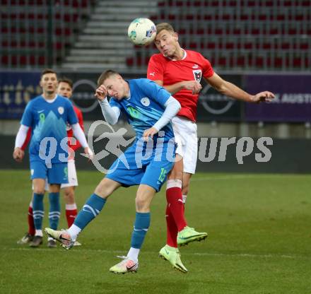 Fussball Laenderspiel Amateure. Oesterreich gegen Slowenien.  Daniel Fischer,  (AUT), Urh Gresovnik  (SLO). Klagenfurt, am 26.11.2023.
Foto: Kuess
www.qspictures.net
---
pressefotos, pressefotografie, kuess, qs, qspictures, sport, bild, bilder, bilddatenbank