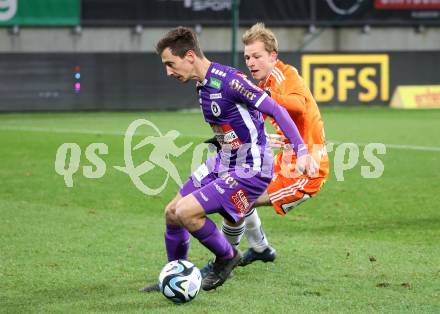 Fussball Bundesliga. SK Austria Klagenfurt gegen TSV Egger Glas Hartberg.  Till Schumacher,  (Klagenfurt),   Christoph Urdl (Hartberg).  Klagenfurt, am 4.12.2023.
Foto: Kuess
---
pressefotos, pressefotografie, kuess, qs, qspictures, sport, bild, bilder, bilddatenbank