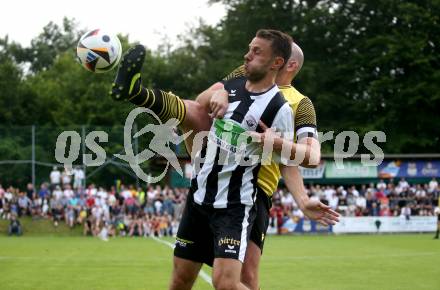 Fussball 1. Klasse C. Ludmannsdorf gegen Oberglan.. Jure Skafar  (Ludmannsdorf),  Christoph Freithofnig  (Oberglan). Ludmannsdorf, am 9.6.2024.
Foto: Kuess
www.qspictures.net
---
pressefotos, pressefotografie, kuess, qs, qspictures, sport, bild, bilder, bilddatenbank