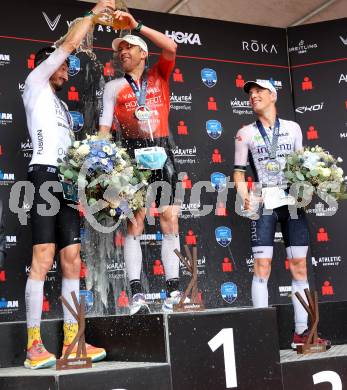 Ironman. Zieleinlauf.  Arthur Horseau (FRA), Denis Chevrot (FRA), Jon Saeveraas Breivold (NOR). Klagenfurt, 16.6.2024.
---
pressefotos, pressefotografie, kuess, qs, qspictures, sport, bild, bilder, bilddatenbank