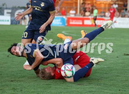 Fussball Kaerntner Liga. SAK gegen Velden.  Marjan Ogris-Martic (SAK),  Roland Putsche (Velden). Welzenegg, am 10.8.2024.
Foto: Kuess
www.qspictures.net
---
pressefotos, pressefotografie, kuess, qs, qspictures, sport, bild, bilder, bilddatenbank