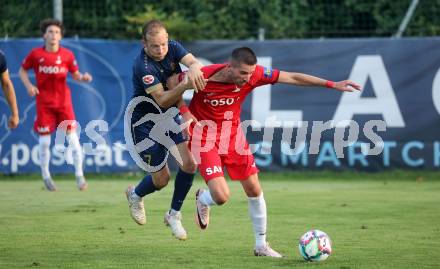 Fussball Kaerntner Liga. SAK gegen Velden.  Hrvoje Jakovljevic (SAK),  Mario Kroepfl (Velden). Welzenegg, am 10.8.2024.
Foto: Kuess
www.qspictures.net
---
pressefotos, pressefotografie, kuess, qs, qspictures, sport, bild, bilder, bilddatenbank