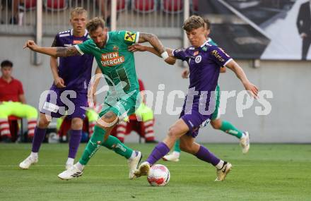 Fussball Bundesliga. SK Austria Klagenfurt gegen SK Rapid. Jannik Robatsch,  (Klagenfurt), Guido Burgstaller  (Rapid).  Klagenfurt, am 11.8.2024.
Foto: Kuess
www.qspictures.net
---
pressefotos, pressefotografie, kuess, qs, qspictures, sport, bild, bilder, bilddatenbank