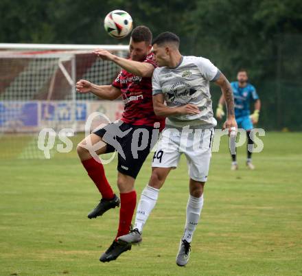 Fussball Kaerntner Liga. ATUS Ferlach gegen Koettmannsdorf.  Martin Posratschnig (Ferlach),  Damjan Jovanovic (Koettmannsdorf). Ferlach, 14.8.2024.
Foto: Kuess
www.qspictures.net
---
pressefotos, pressefotografie, kuess, qs, qspictures, sport, bild, bilder, bilddatenbank