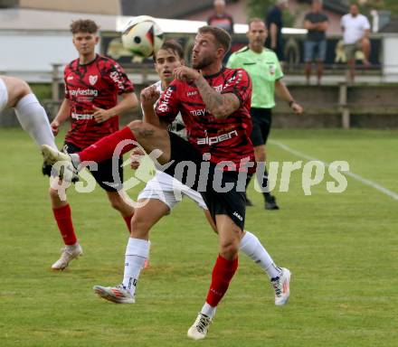 Fussball Kaerntner Liga. ATUS Ferlach gegen Koettmannsdorf.  Daniel Jobst (Ferlach),  Daniel Hans Genser (Koettmannsdorf). Ferlach, 14.8.2024.
Foto: Kuess
www.qspictures.net
---
pressefotos, pressefotografie, kuess, qs, qspictures, sport, bild, bilder, bilddatenbank