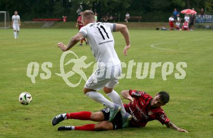 Fussball Kaerntner Liga. ATUS Ferlach gegen Koettmannsdorf.  Martin Sustersic (Ferlach), Aner Mandzic  (Koettmannsdorf). Ferlach, 14.8.2024.
Foto: Kuess
www.qspictures.net
---
pressefotos, pressefotografie, kuess, qs, qspictures, sport, bild, bilder, bilddatenbank