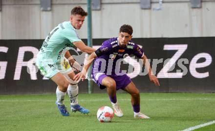 Fussball Bundesliga.  SK Austria Klagenfurt gegen TSV Egger Glas Hartberg .  Ben Bobzien,  (Klagenfurt),  Paul Komposch (Hartberg). Klagenfurt, am 21.9.2024.
Foto: Kuess
www.qspictures.net
---
pressefotos, pressefotografie, kuess, qs, qspictures, sport, bild, bilder, bilddatenbank