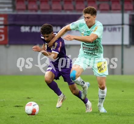 Fussball Bundesliga.  SK Austria Klagenfurt gegen TSV Egger Glas Hartberg . Ben Bobzien,   (Klagenfurt),  Marco Phillip Hoffmann (Hartberg). Klagenfurt, am 21.9.2024.
Foto: Kuess
www.qspictures.net
---
pressefotos, pressefotografie, kuess, qs, qspictures, sport, bild, bilder, bilddatenbank