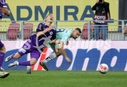 Fussball Bundesliga.  SK Austria Klagenfurt gegen TSV Egger Glas Hartberg .  Jonas Kuehn,  (Klagenfurt),  Juergen Heil (Hartberg). Klagenfurt, am 21.9.2024.
Foto: Kuess
www.qspictures.net
---
pressefotos, pressefotografie, kuess, qs, qspictures, sport, bild, bilder, bilddatenbank