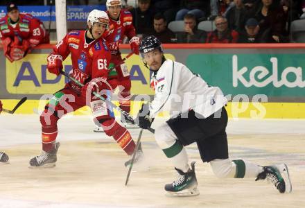 EBEL. Eishockey Bundesliga. KAC gegen Olimpija Ljubljana.  Luka Gomboc,   (KAC), Ziga Pavlin  (Ljubljana). Klagenfurt, 22.9.2024. 
Foto: Kuess
www.qspictures.net
---
pressefotos, pressefotografie, kuess, qs, qspictures, sport, bild, bilder, bilddatenbank