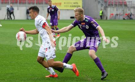 Fussball Bundesliga.  SK Austria Klagenfurt gegen Austria Wien .  Christopher Cvetko,  (Klagenfurt), Manfred Fischer  (Wien). Klagenfurt, am 20.10.2024.
Foto: Kuess
www.qspictures.net
---
pressefotos, pressefotografie, kuess, qs, qspictures, sport, bild, bilder, bilddatenbank