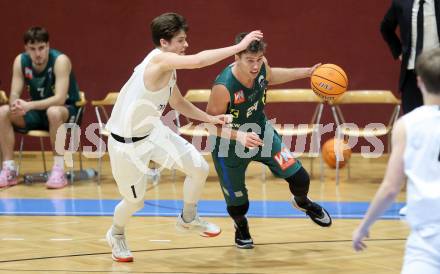 Basketball 2. Liga 2024/2025. Grunddurchgang 17. Runde.  KOS Celovec gegen Dornbirn Lions.   Simon Siencnik (KOS Celovec),  Eduard Nogues  (Dornbirn Lions). Klagenfurt, am 1.2.2025.
Foto: Kuess


---
pressefotos, pressefotografie, kuess, qs, qspictures, sport, bild, bilder, bilddatenbank