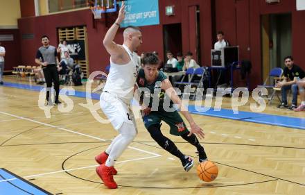 Basketball 2. Liga 2024/2025. Grunddurchgang 17. Runde.  KOS Celovec gegen Dornbirn Lions.   Nikolas Susa (KOS Celovec),  Eduard Nogues  (Dornbirn Lions). Klagenfurt, am 1.2.2025.
Foto: Kuess


---
pressefotos, pressefotografie, kuess, qs, qspictures, sport, bild, bilder, bilddatenbank