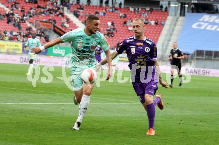 Fussball Bundesliga. SK Austria Klagenfurt gegen Hartberg. Florian Jaritz,  (SK Austria Klagenfurt), Mateo Karamatic (Hartberg). Klagenfurt, am 23.5.2025.
Foto: Kuess
www.qspictures.net
---
pressefotos, pressefotografie, kuess, qs, qspictures, sport, bild, bilder, bilddatenbank