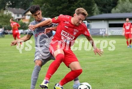 Fussball Kaerntner Liga. Grafenstein gegen Koettmannsdorf. Dennis Meschnik  (Grafenstein),   Amir Mohammadi (Koettmannsdorf). Grafenstein, am 1.8..2025.
Foto: Kuess
www.qspictures.net
---
pressefotos, pressefotografie, kuess, qs, qspictures, sport, bild, bilder, bilddatenbank