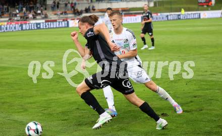 Fussball Bundesliga. Wolfsberger AC  gegen SCR Altach.  Marco Alessandro Sulzner (Wolfsberg),  Patrick Sebastian Greil  (Altach). Wolfsberg, am 2.8..2025.
Foto: Kuess
www.qspictures.net
---
pressefotos, pressefotografie, kuess, qs, qspictures, sport, bild, bilder, bilddatenbank