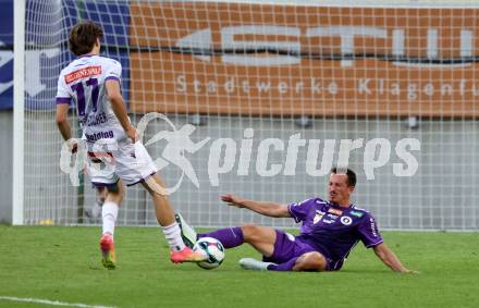 Fussball 2. Liga. SK Austria Klagenfurt gegen Young Violett Austria Wien.  Michael Lang (Klagenfurt),   Marijan Oesterreicher (Wien). Klagenfurt, 8.8.2025.
Foto: Kuess
www.qspictures.net
---
pressefotos, pressefotografie, kuess, qs, qspictures, sport, bild, bilder, bilddatenbank