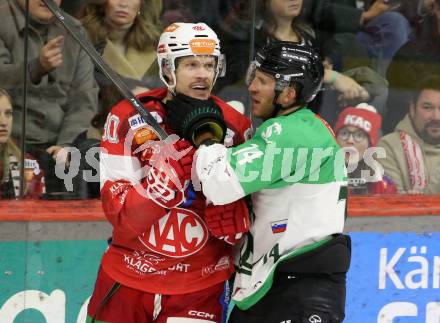 Eishockey ICE Bundesliga. KAC gegen Olimpija Ljubljana. Matthew Fraser  (KAC),  Nathanael Halbert (Olimpija Ljubljana). Klagenfurt, am 26.10.2025
Foto: Kuess
---
pressefotos, pressefotografie, kuess, qs, qspictures, sport, bild, bilder, bilddatenbank